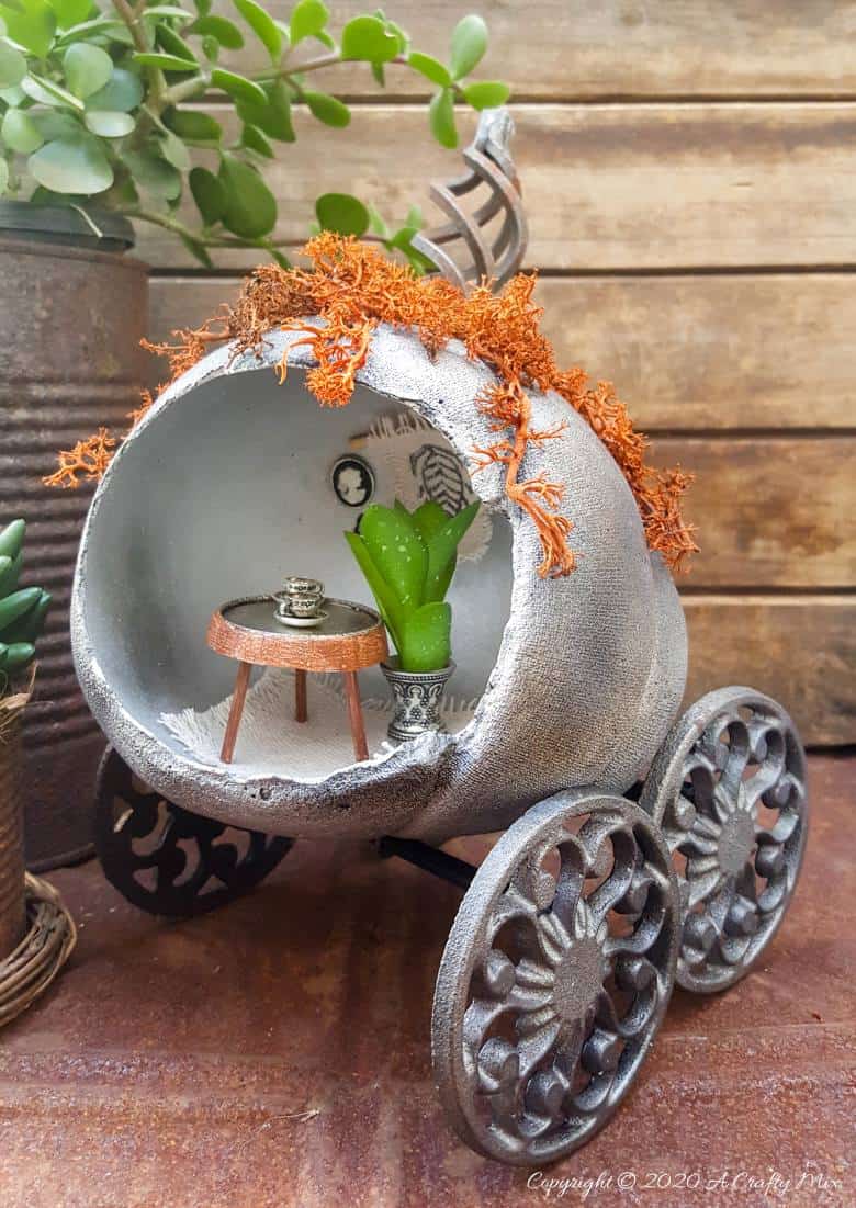 Ever wondered what happened to Cinderella’s pumpkin coach after she and the Prince got married and lived happily ever after? Those little mice turned it into their secret hideaway and they shared the tutorial on how they did it with us. #FalldecorDIY #Pumpkincoach #ACraftyMix #PumpkinDecor #PumpkinCrafts