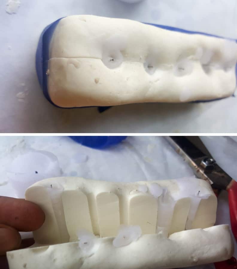 Wait a few seconds for the candle wax to set properly and demold the candles