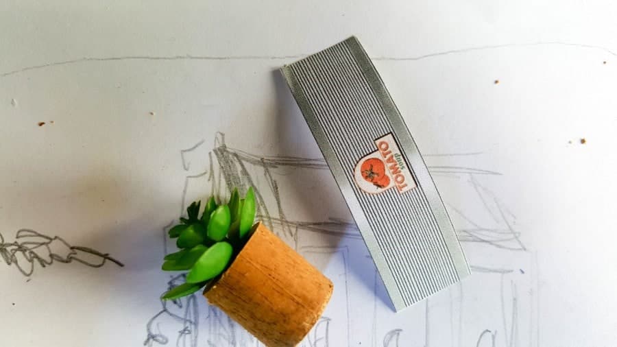 To make the miniature tomato can succulent planter, print the label and glue it onto a cut dowel stick.