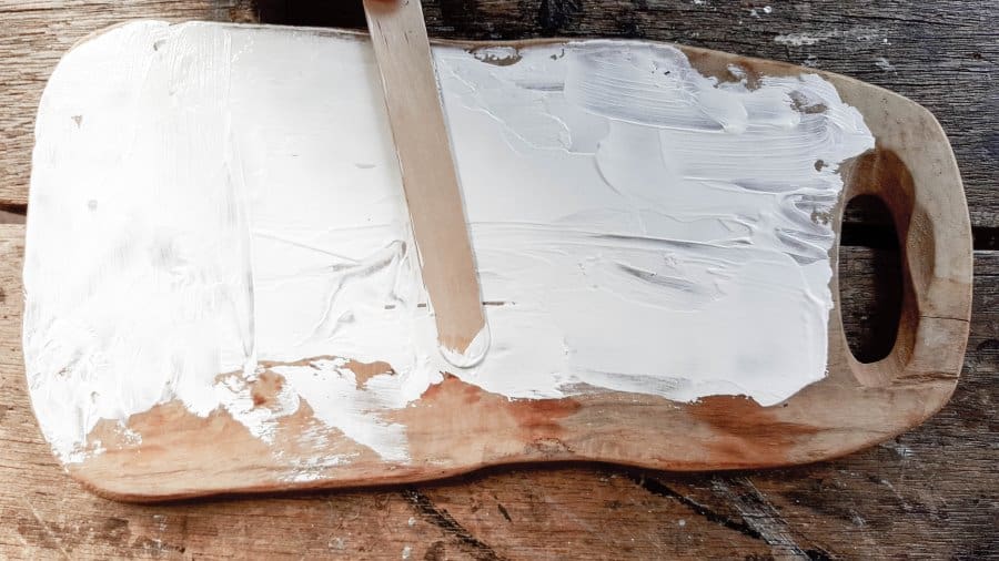 Cover the entire cutting board with gesso to create a blank canvas