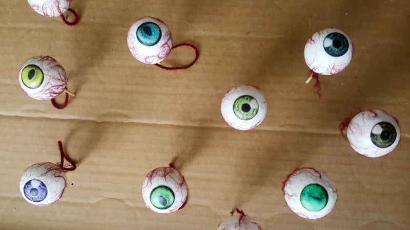 Wait for the mod podge to dry completely before dipping the eyeballs in a high gloss varnish or mod podge