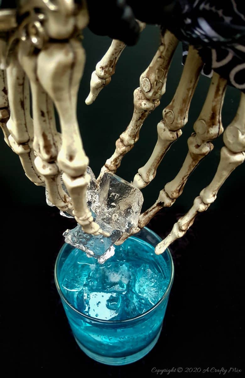 If you&rsquo;re looking for a humerus Halloween repurpose idea that&rsquo;s functional and guaranteed to make your guests smile, then you&rsquo;ll love these skeleton hand ice tongs. #HalloweenCraft #SkeletonIceTongs #ACraftyMix #DIYHalloween #SkeletonTongs