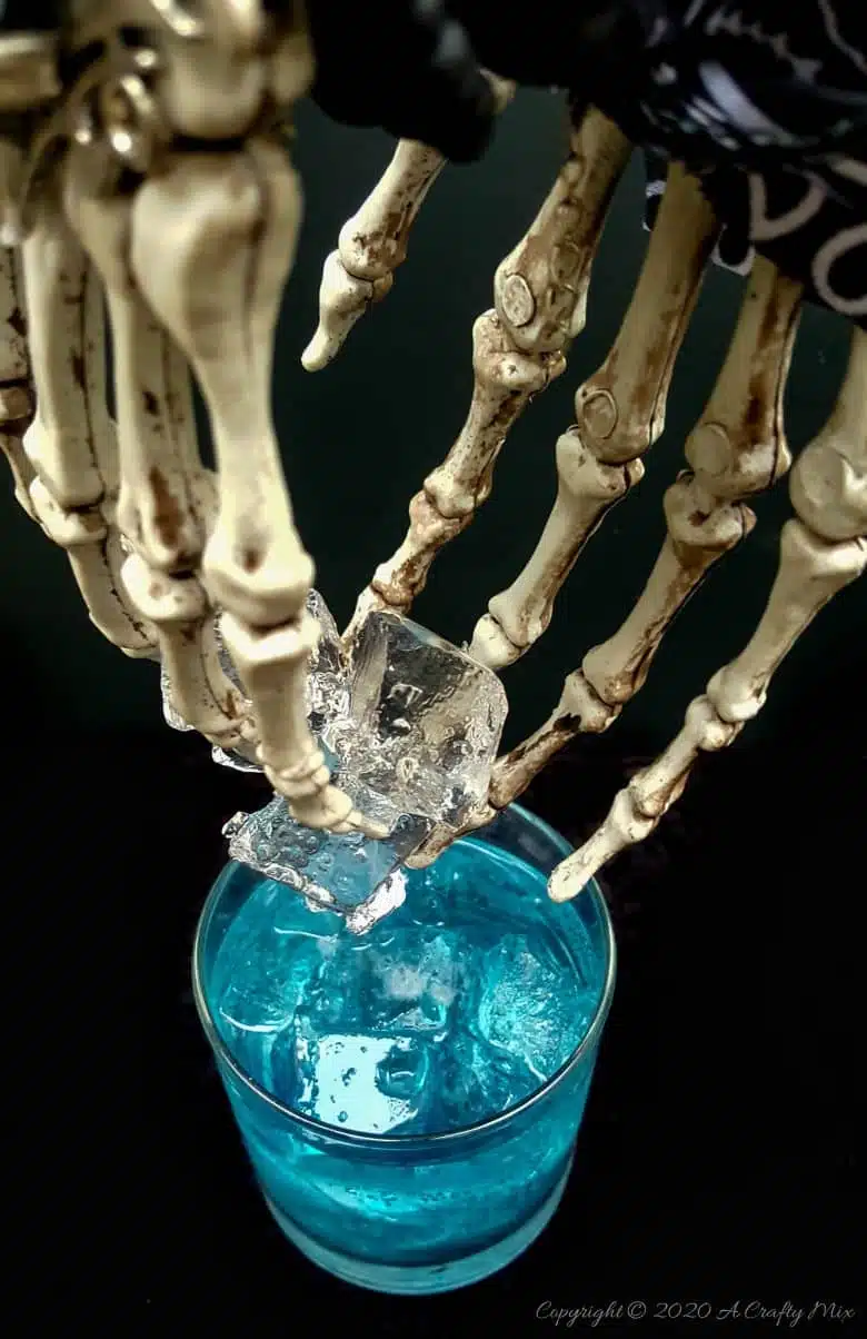 If you’re looking for a humerus Halloween repurpose idea that’s functional and guaranteed to make your guests smile, then you’ll love these skeleton hand ice tongs. #HalloweenCraft #SkeletonIceTongs #ACraftyMix #DIYHalloween #SkeletonTongs