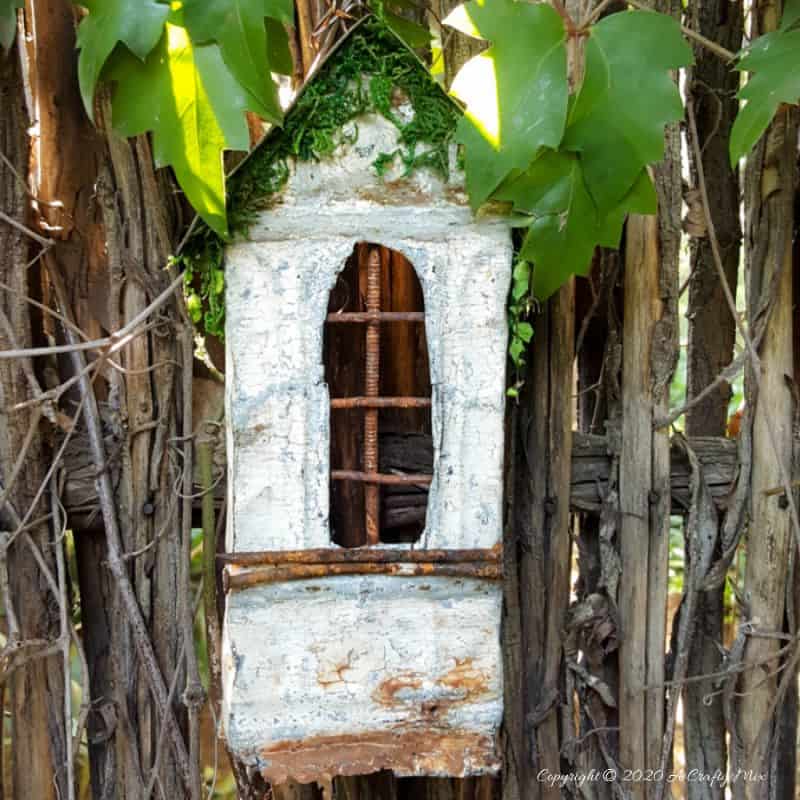 This easy to follow tutorial will show you to repurpose rusty scrap metal bits into a fairy bay window with lights. #FairyWindow #fairyCrafts #ACraftyMix #ScrapMetalRepurpose #TinCeilingTiles