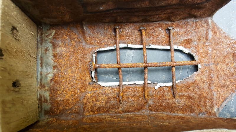 Glue rusty nails over the window