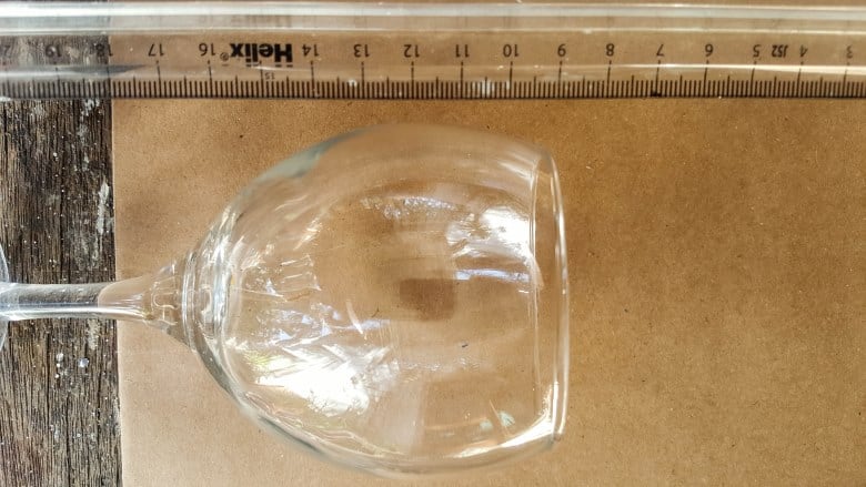 Measure the height of the wine glass to figure out how high the cone needs to be