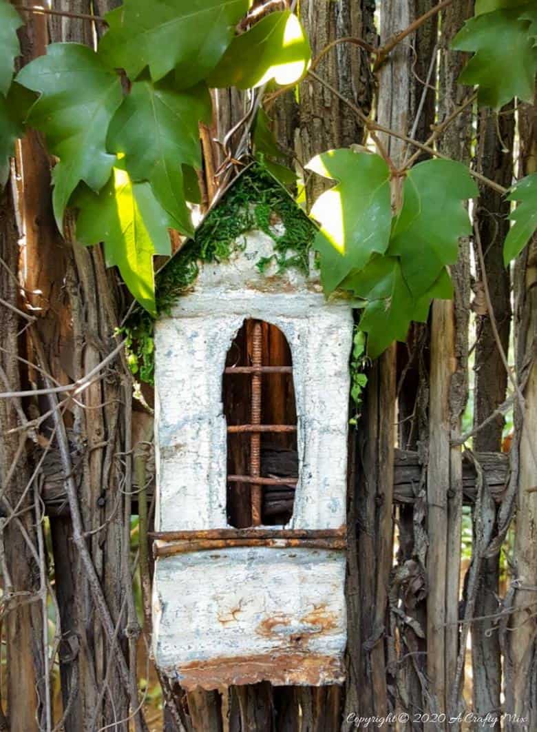 This easy to follow tutorial will show you to repurpose rusty scrap metal bits into a fairy bay window with lights. #FairyWindow #fairyCrafts #ACraftyMix #ScrapMetalRepurpose #TinCeilingTiles