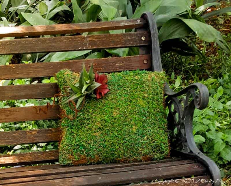Take your garden decor to a whole new level with this beautiful moss pillow succulent planter. Not only is it easy to make but it also adds a magical touch to any outdoor space #gardendecor #mosspillow #acraftymix #succulentplanter #gardendecorideas