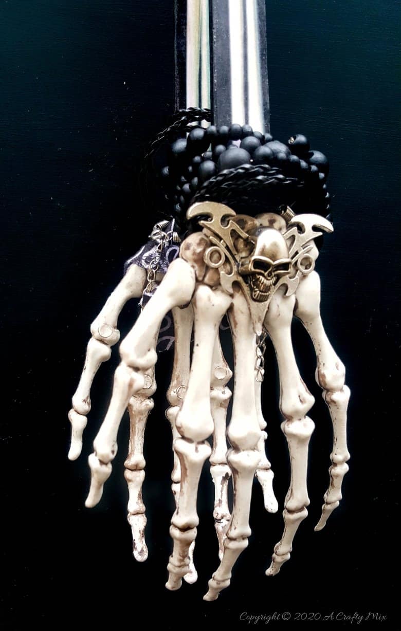 If you&rsquo;re looking for a humerus Halloween repurpose idea that&rsquo;s functional and guaranteed to make your guests smile, then you&rsquo;ll love these skeleton hand ice tongs. #HalloweenCraft #SkeletonIceTongs #ACraftyMix #DIYHalloween #SkeletonTongs