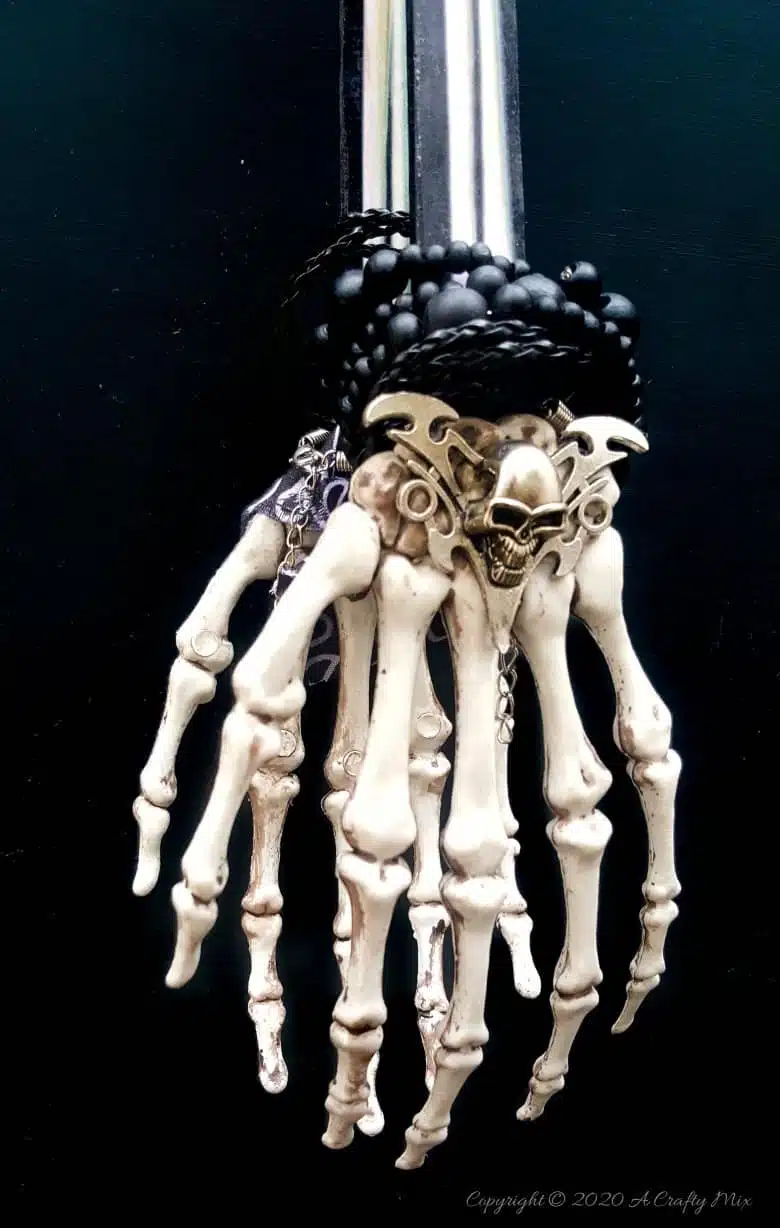 If you’re looking for a humerus Halloween repurpose idea that’s functional and guaranteed to make your guests smile, then you’ll love these skeleton hand ice tongs. #HalloweenCraft #SkeletonIceTongs #ACraftyMix #DIYHalloween #SkeletonTongs