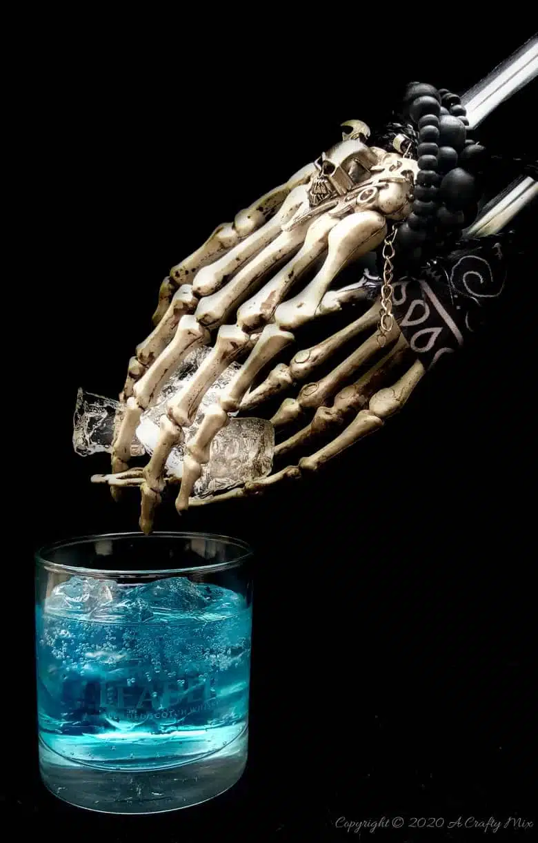 If you’re looking for a humerus Halloween repurpose idea that’s functional and guaranteed to make your guests smile, then you’ll love these skeleton hand ice tongs. #HalloweenCraft #SkeletonIceTongs #ACraftyMix #DIYHalloween #SkeletonTongs