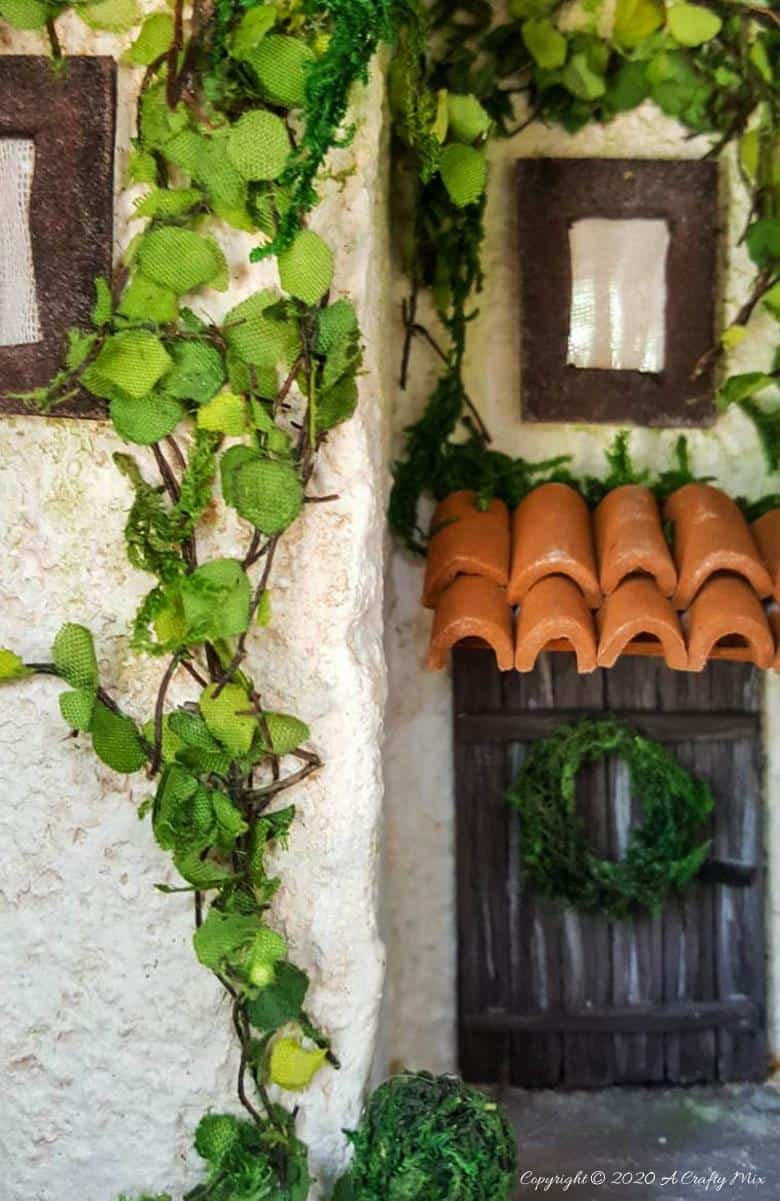 Add a little festive magic to your bookshelf with a book nook. These gorgeous miniature scenes captured in a book are trending right now and putting one together is easier than you think and whole bunch of fun too. #booknook #booktome #ACraftyMix #makingminiatures