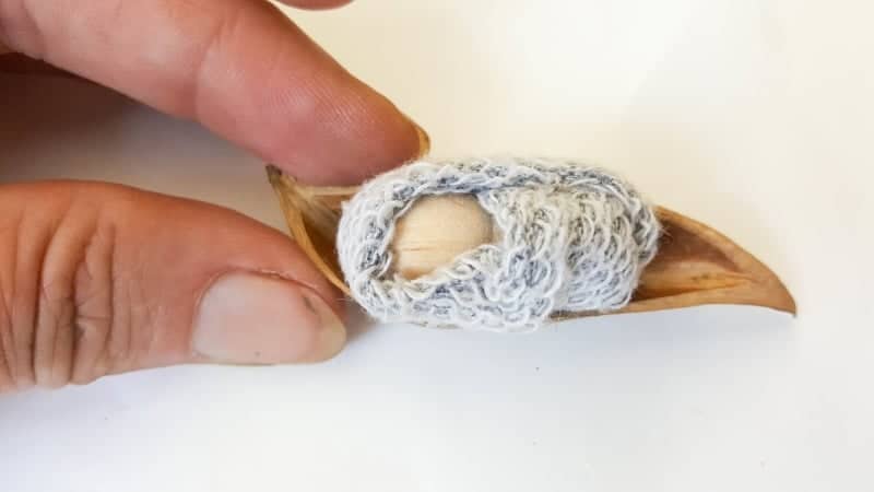 This easy to follow tutorial will show you how to make a rustic clothespin Nativity scene out of fabric scraps and wooden pegs. The tutorial includes a &ldquo;free to download&rdquo; printable for the angel wings and detailed instructions to make Mary, Joseph, the Angel and baby Jesus #ClothesPinCrafts #DIYNativity #WoodenPegCrafts #ACraftyMix #ChristmasCrafts #NativityScene