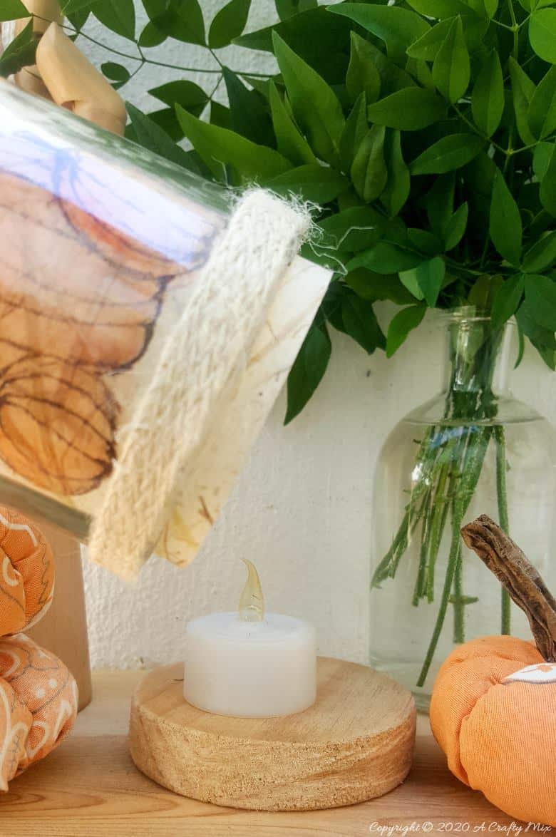 Take your glass bottle light to a whole new level with this DIY idea. A quick and easy way to repurpose and customize ONE bottle to fit any occasion or season with swappable art inserts. And you&rsquo;ll have loads of fun coming up with new images to put inside too. #bottlelight #winebottlelights #acraftymix #bottlerepurpose #bottlecrafts