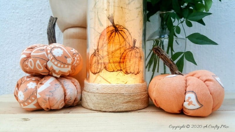 Take your glass bottle light to a whole new level with this DIY idea. A quick and easy way to repurpose and customize ONE bottle to fit any occasion or season with swappable art inserts. And you&rsquo;ll have loads of fun coming up with new images to put inside too. #bottlelight #winebottlelights #acraftymix #bottlerepurpose #bottlecrafts