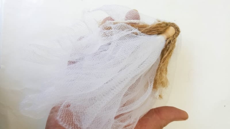 Glue the folded tulle strips around the "neck-line"