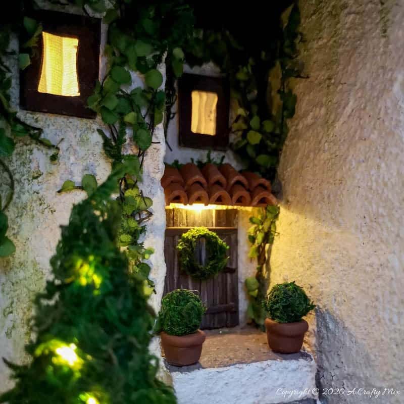 Add a little festive magic to your bookshelf with a book nook. These gorgeous miniature scenes captured in a book are trending right now and putting one together is easier than you think and whole bunch of fun too. #booknook #booktome #ACraftyMix #makingminiatures