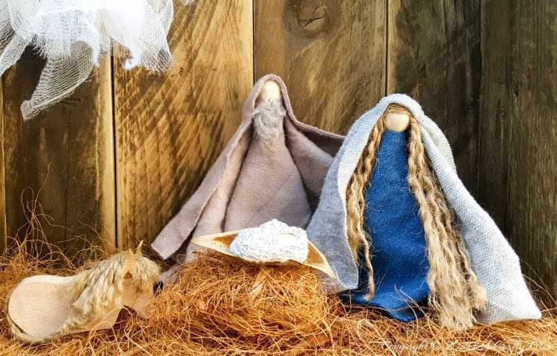 This easy to follow tutorial with show you how to make a rustic clothespin Nativity scene out of fabric scraps and wooden pegs. The tutorial includes a &ldquo;free to download&rdquo; printable for the angel wings and detailed instructions to make Mary, Joseph, the Angel and baby Jesus #ClothesPinCrafts #DIYNativity #WoodenPegCrafts #ACraftyMix #ChristmasCrafts #NativityScene