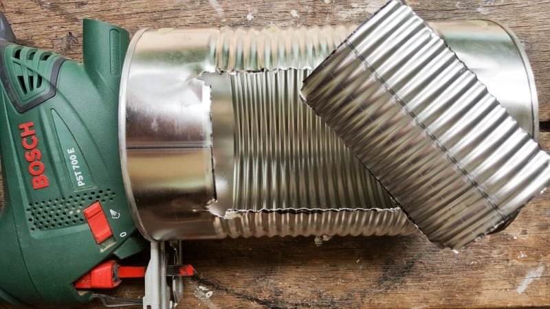 The opening in the tin can after cutting with a jigsaw