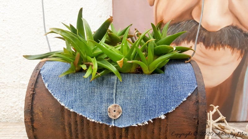 I love recycling tin cans into planters like this one. We call it the rusty tin can barrel bag planter. Quite a mouth full but it&rsquo;s really easy to do with things you would normally throw away. #Barrelbag #TinCanRepupose #ACraftyMix #DIYPlanter #TinCanPlanter #recycledtincan #DenimCrafts