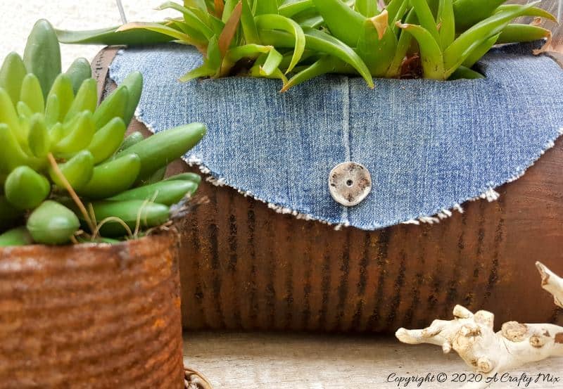 I love recycling tin cans into planters like this one. We call it the rusty tin can barrel bag planter. Quite a mouth full but it&rsquo;s really easy to do with things you would normally throw away. #Barrelbag #TinCanRepupose #ACraftyMix #DIYPlanter #TinCanPlanter #recycledtincan #DenimCrafts