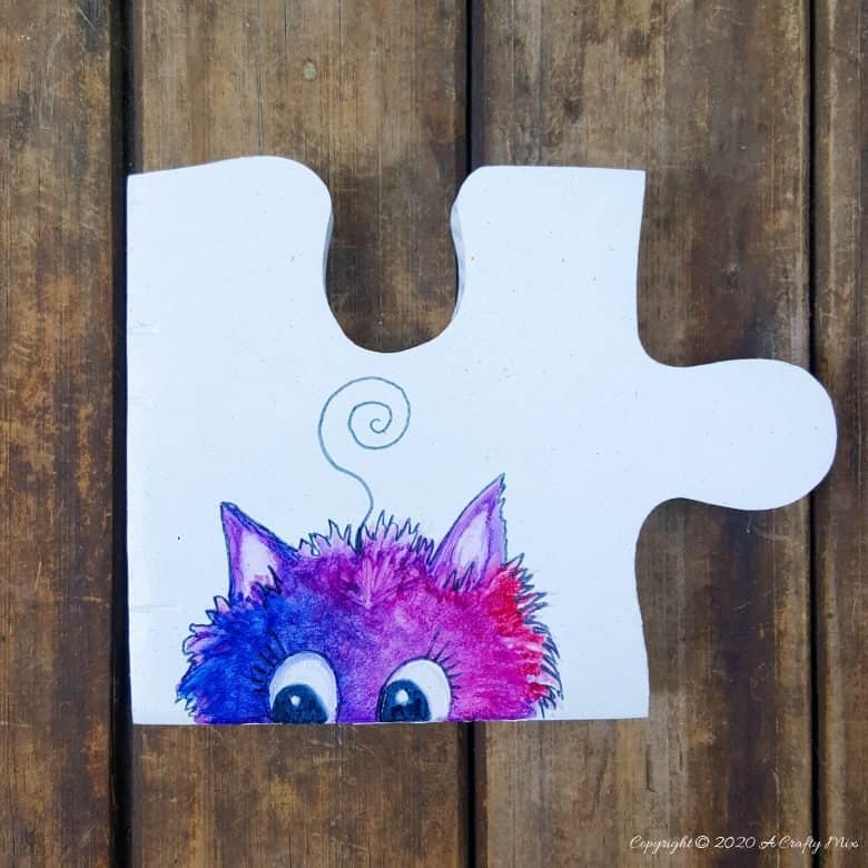 Best DIY Gift Idea EVER!!! Curious Kitty Puzzle Pieces that can be used as coasters or a platter. The full tutorial will show you how to make your own and includes a free template for the puzzle as well as all four kitties. #PuzzleCoasters #DIYGiftIdea #ACraftyMix #PuzzlePlatter ##DIYPuzzle #FreePrintable