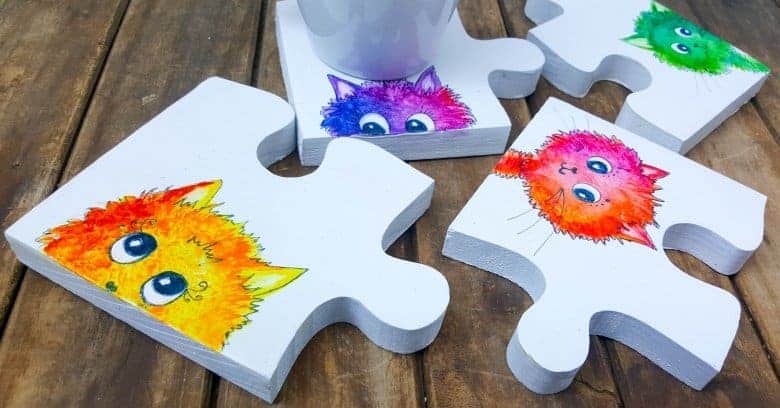 Best DIY Gift Idea EVER!!! Curious Kitty Puzzle Coasters that double up as a platter when you put them all together.  The full tutorial will show you how to make your own and includes a free template for the puzzle as well as all four kitties. #PuzzleCoasters #DIYGiftIdea #ACraftyMix #PuzzlePlatter ##DIYPuzzle #FreePrintable