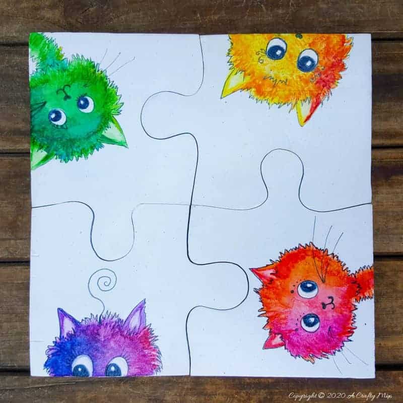 Best DIY Gift Idea EVER!!! Curious Kitty Puzzle Coasters that double up as a platter when you put them all together. The full tutorial will show you how to make your own and includes a free template for the puzzle as well as all four kitties. #PuzzleCoasters #DIYGiftIdea #ACraftyMix #PuzzlePlatter ##DIYPuzzle #FreePrintable