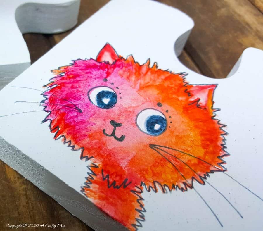 Best DIY Gift Idea EVER!!! Curious Kitty Puzzle Coasters that double up as a platter when you put them all together. The full tutorial will show you how to make your own and includes a free template for the puzzle as well as all four kitties. #PuzzleCoasters #DIYGiftIdea #ACraftyMix #PuzzlePlatter ##DIYPuzzle #FreePrintable