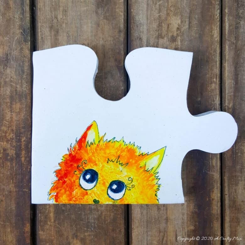 Best DIY Gift Idea EVER!!! Curious Kitty Puzzle Pieces that can be used as coasters or a platter. The full tutorial will show you how to make your own and includes a free template for the puzzle as well as all four kitties. #PuzzleCoasters #DIYGiftIdea #ACraftyMix #PuzzlePlatter ##DIYPuzzle #FreePrintable