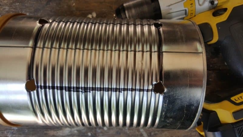 Drill four large holes in the corners