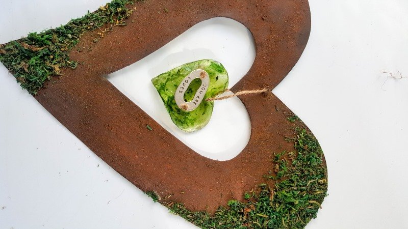 Hang the resin heart from the cardboard heart