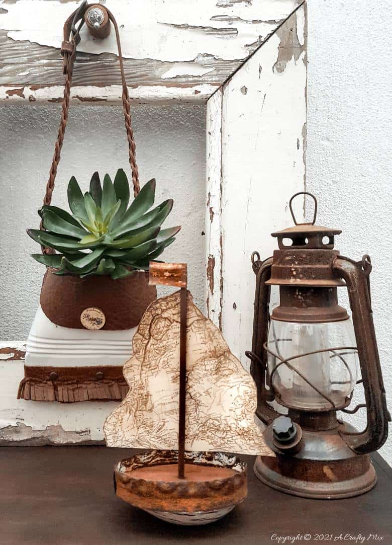 Looking to add some rustic charm to your coastal decor? This concrete avocado sailboat is quick and easy to make and it's budget-friendly too. Customise the little boat and add a map sail of your favorite place or country. #avocadoupcycle #ACraftyMix #coastaldecor #concretedecor