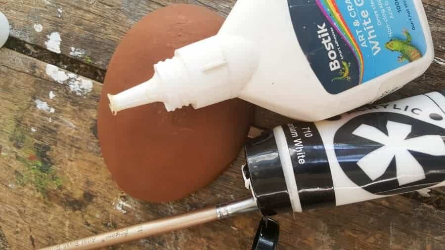 I used craft glue and acrylic paints to paint my avocado sailboat