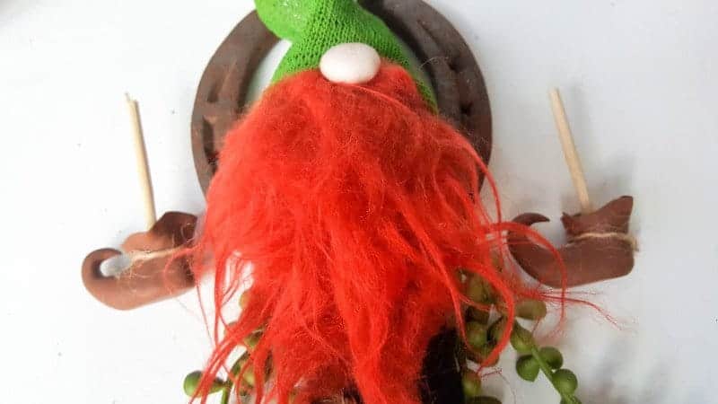 Glue the hat on top of the leprechaun nose and beard