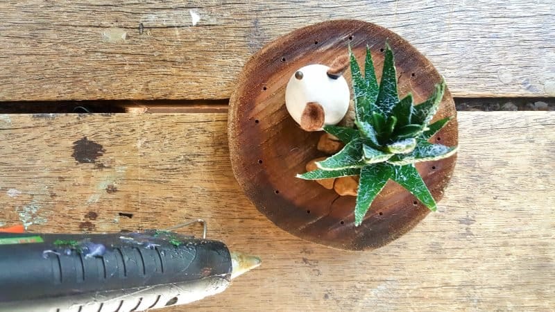 Glue the mouse and faux succulent on top of the slice of wood
