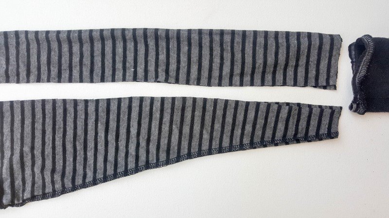 Cut the t-shirt arms to make a strap for the sweater handbag