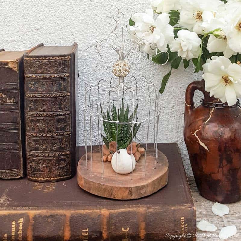 This easy to follow tutorial will show you how to make your own art deco wire bird cage. Made in a morning, it&rsquo;s a fun way to add a little handcrafted glamour to you d&eacute;cor. #BirdCage #DIY #ACraftyMix