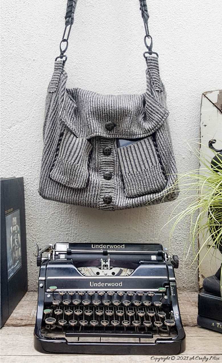 Don&rsquo;t throw that old sweater away until you&rsquo;ve seen how easy it is to turn a sweater into a handbag. The tutorial includes a short video that will show you where to cut the sweater and includes step-by-step instructions to make your own. #SweaterHandbag #EasySew #ACraftyMix #HandbagPattern #SweaterRepurpose