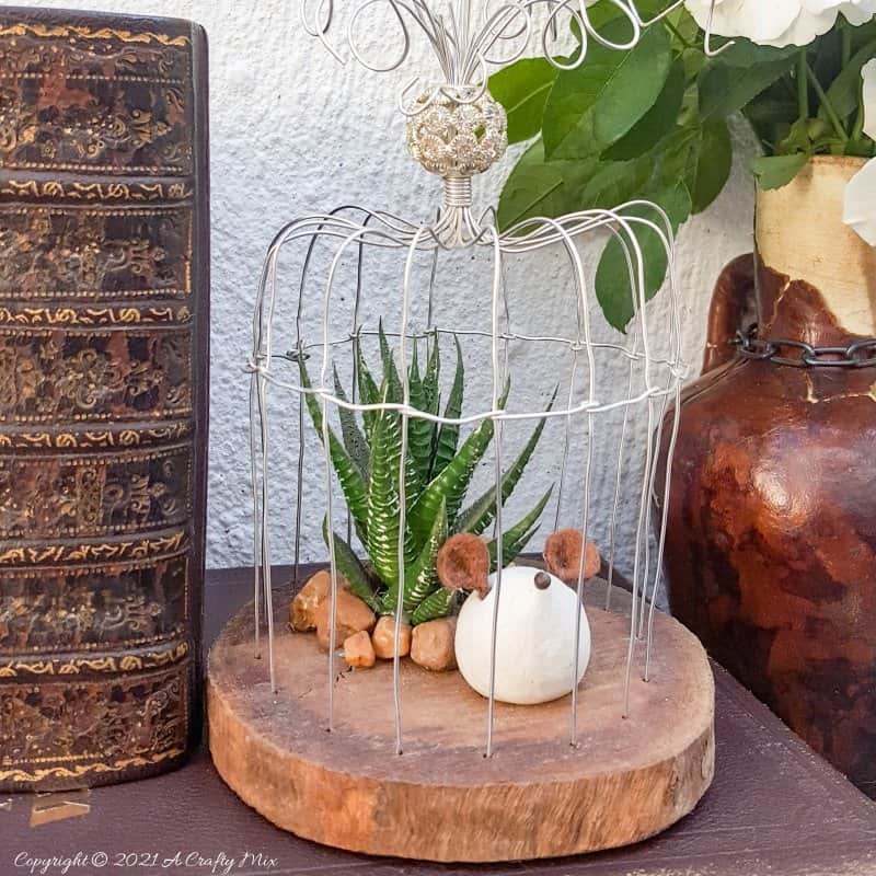 This easy to follow tutorial will show you how to make your own art deco wire bird cage. Made in a morning, it&rsquo;s a fun way to add a little handcrafted glamour to you d&eacute;cor. #BirdCage #DIY #ACraftyMix