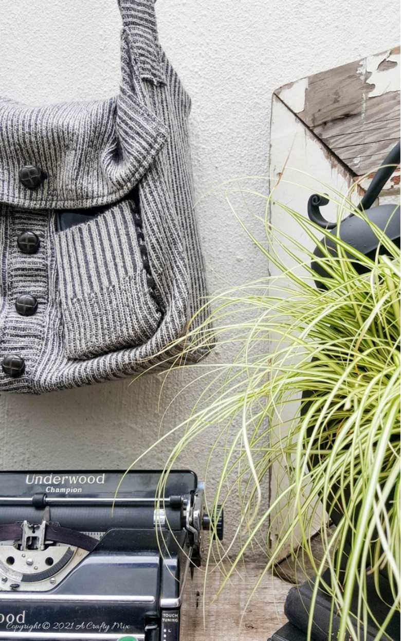 Don&rsquo;t throw that old sweater away until you&rsquo;ve seen how easy it is to turn a sweater into a handbag. The tutorial includes a short video that will show you where to cut the sweater and includes step-by-step instructions to make your own. #SweaterHandbag #EasySew #ACraftyMix #HandbagPattern #SweaterRepurpose