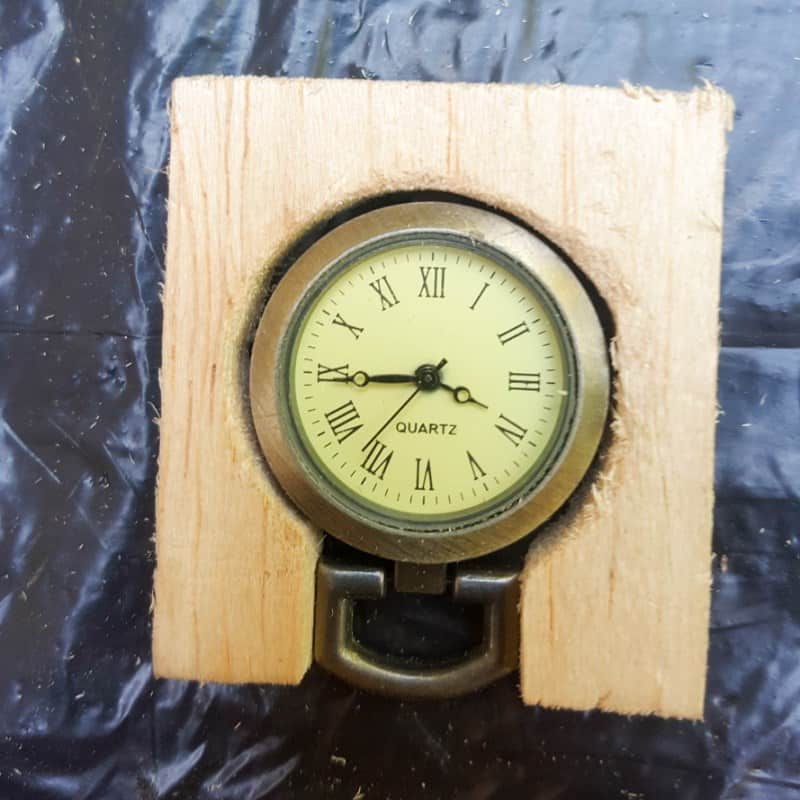 Cut the balsa wood to fit the clock face