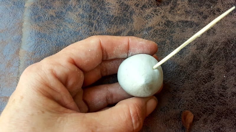 Use a toothpick to make two small holes on either side of the mouse's head