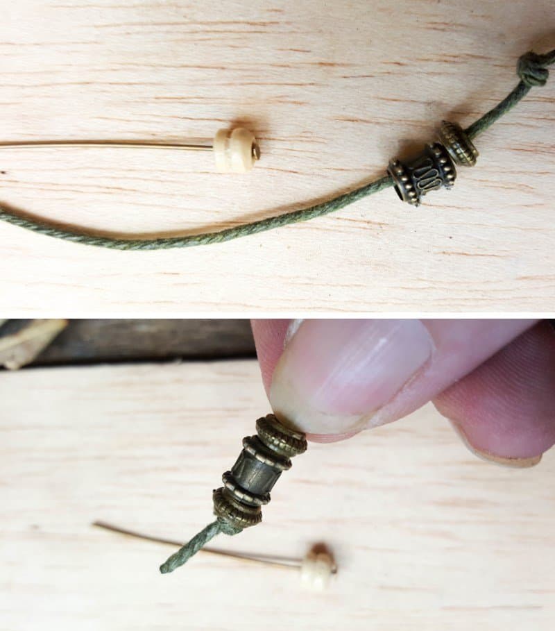 Use beads to make the clock weights and pendulum