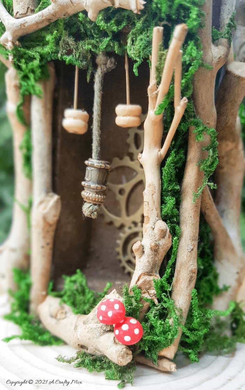 Have you ever wanted to make a real working fairy grandfather clock? This tutorial will show you how and includes a downloadable template along with instructions to make teeny, tiny mushrooms and a fairy bird&rsquo;s nest. #FairyCrafts #ACraftyMix #MiniatureGrandfatherClock
