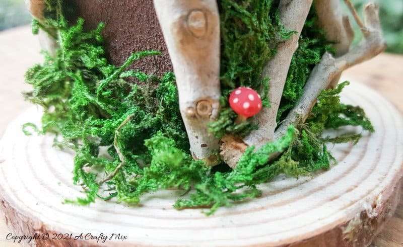 Have you ever wanted to make a real working fairy grandfather clock? This tutorial will show you how and includes a downloadable template along with instructions to make teeny, tiny mushrooms and a fairy bird&rsquo;s nest. #FairyCrafts #ACraftyMix #MiniatureGrandfatherClock
