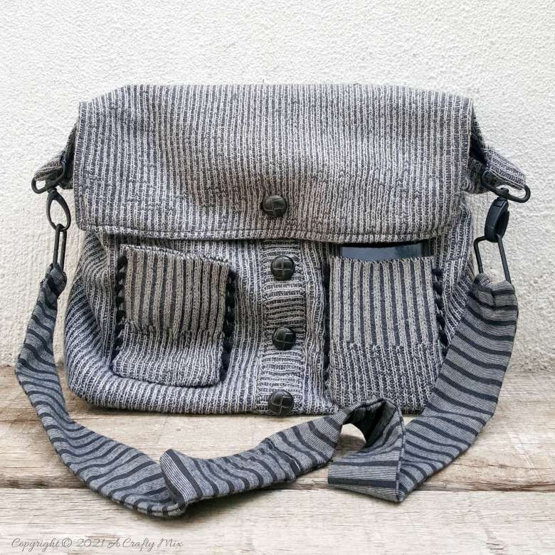 Don&rsquo;t throw that old sweater away until you&rsquo;ve seen how easy it is to turn a sweater into a handbag. The tutorial includes a short video that will show you where to cut the sweater and includes step-by-step instructions to make your own. #SweaterHandbag #EasySew #ACraftyMix #HandbagPattern #SweaterRepurpose