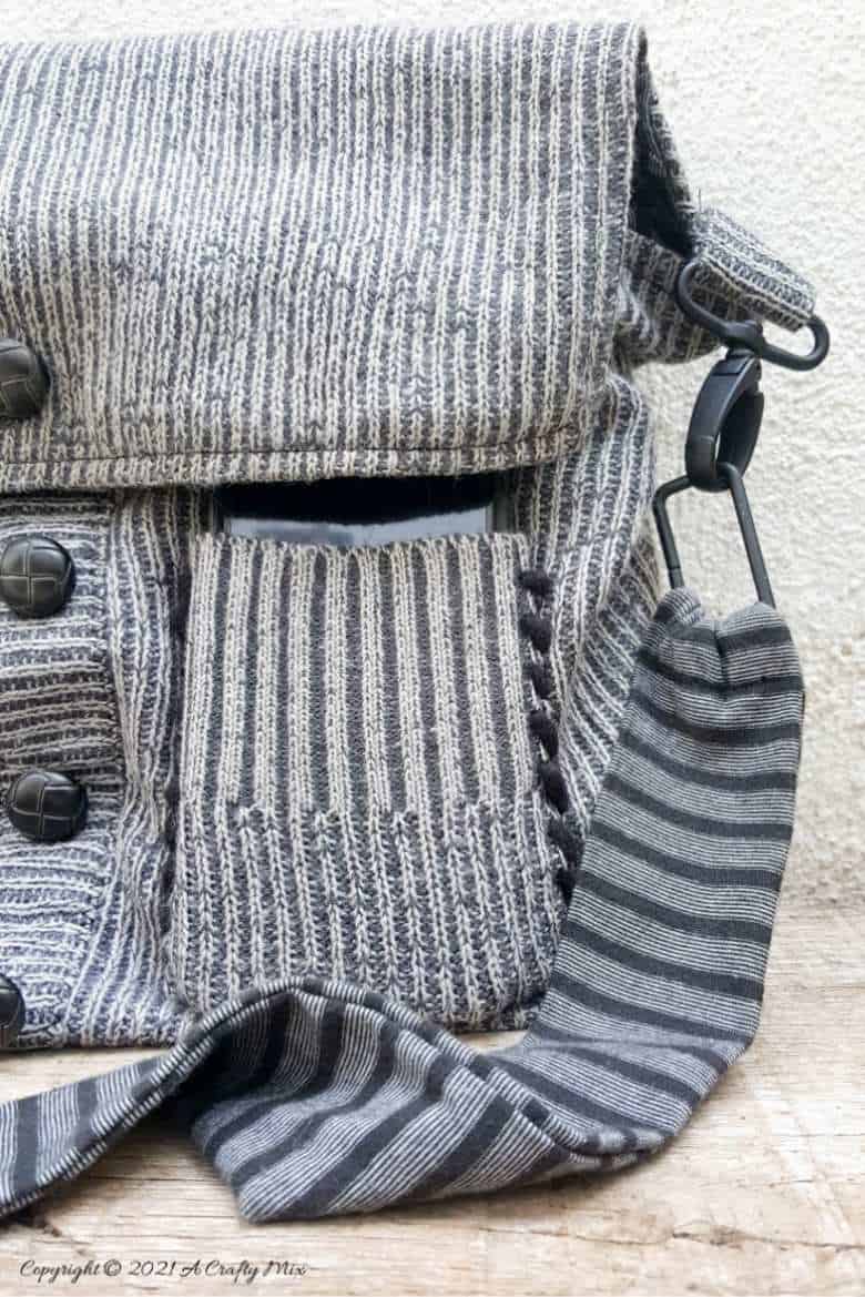 Don&rsquo;t throw that old sweater away until you&rsquo;ve seen how easy it is to turn a sweater into a handbag. The tutorial includes a short video that will show you where to cut the sweater and includes step-by-step instructions to make your own. #SweaterHandbag #EasySew #ACraftyMix #HandbagPattern #SweaterRepurpose