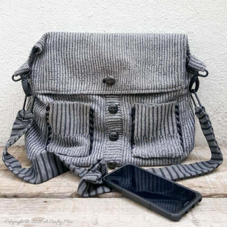 Don&rsquo;t throw that old sweater away until you&rsquo;ve seen how easy it is to turn a sweater into a handbag. The tutorial includes a short video that will show you where to cut the sweater and includes step-by-step instructions to make your own. #SweaterHandbag #EasySew #ACraftyMix #HandbagPattern #SweaterRepurpose