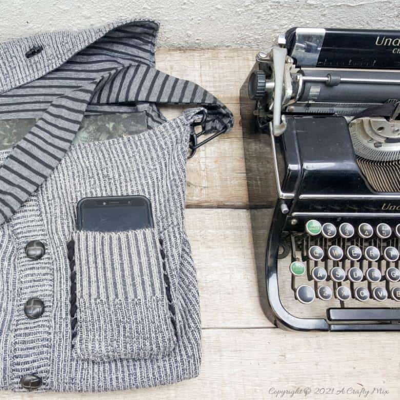 Don&rsquo;t throw that old sweater away until you&rsquo;ve seen how easy it is to turn a sweater into a handbag. The tutorial includes a short video that will show you where to cut the sweater and includes step-by-step instructions to make your own. #SweaterHandbag #EasySew #ACraftyMix #HandbagPattern #SweaterRepurpose